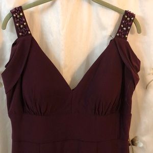 Formal gown with peekaboo sleeves.